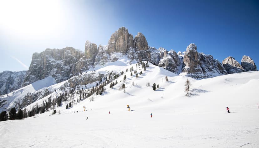 Skiiers enjoying dolomites ski slope